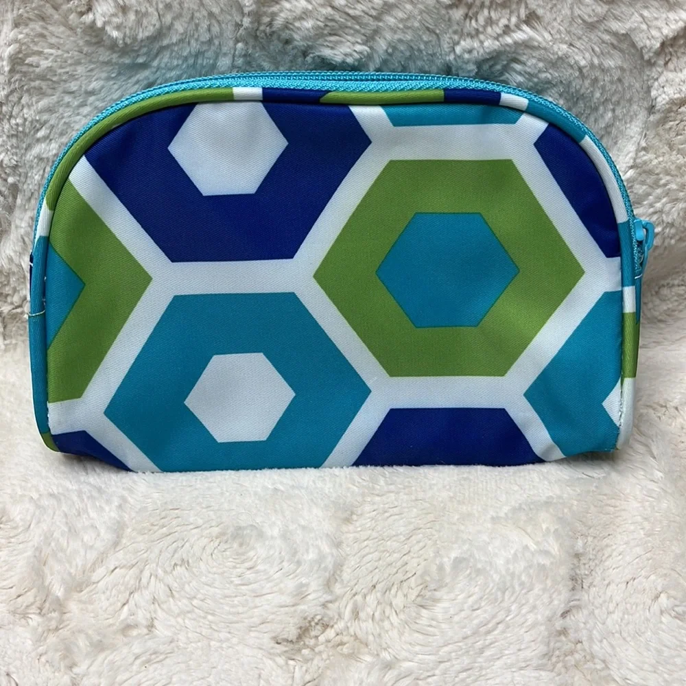 Small cosmetic bag with zip top closure.
